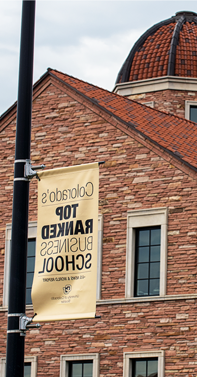 photo of Koelbel with banner that reads "科罗拉多州's Top Ranked Business School"