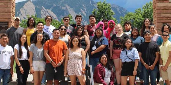 a group of students standing in front of Farrand Field