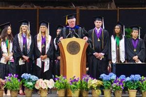 Professor Lewis O. Harvey, Jr., announces the honors graduates