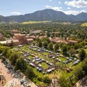 Tables and campus community members fill Farrand Field during the Be Involved Fair