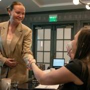 Adelyn Dozier, right, shakes hands with one of the judges from Omni Interlocken