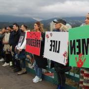 Women, Life, Freedom signs held by protestors